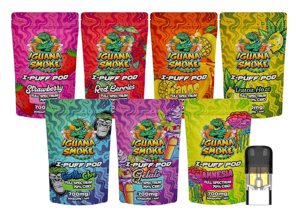 Assorted packages of Iguana Smoke vape pods with colorful packaging on a white background.
