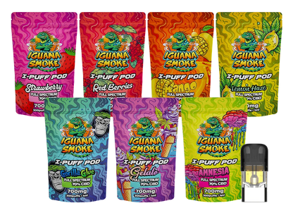 Assorted packages of Iguana Smoke vape pods with colorful packaging on a white background.