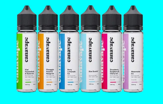 Multiple bottles of Canavape CBD e-liquid in various flavors, with colorful labels and black caps, arranged side by side.