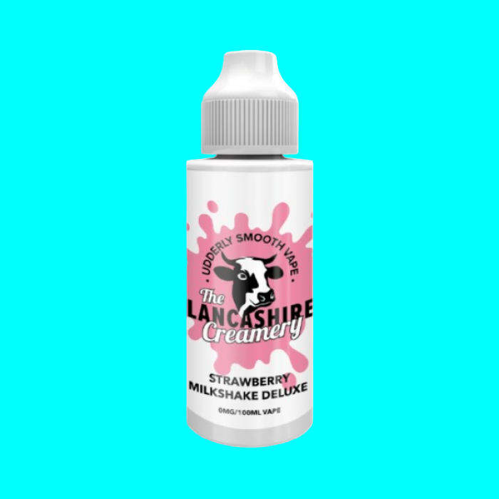 A bottle of The Lancashire Creamery strawberry milk deluxe e-liquid with a label featuring a cartoon cow and pink splashes.