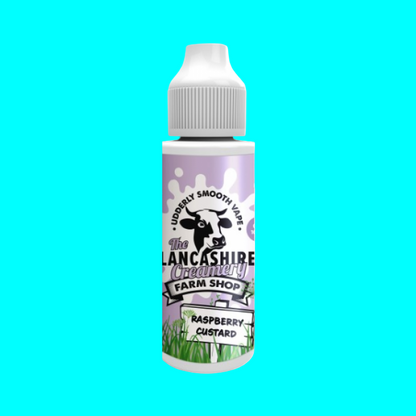 A bottle of Lancashire Creamery raspberry custard e-liquid with a label featuring a cow and the brand name, set against a white background.